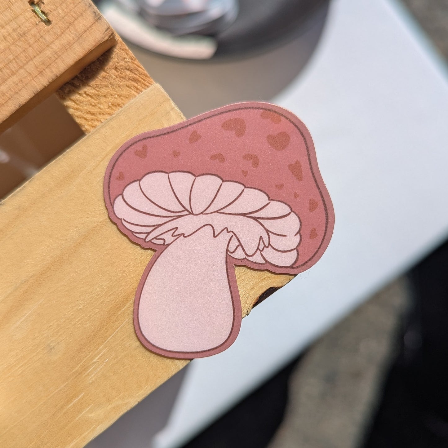 Cute pink and red mushroom sticker has hearts on the cap