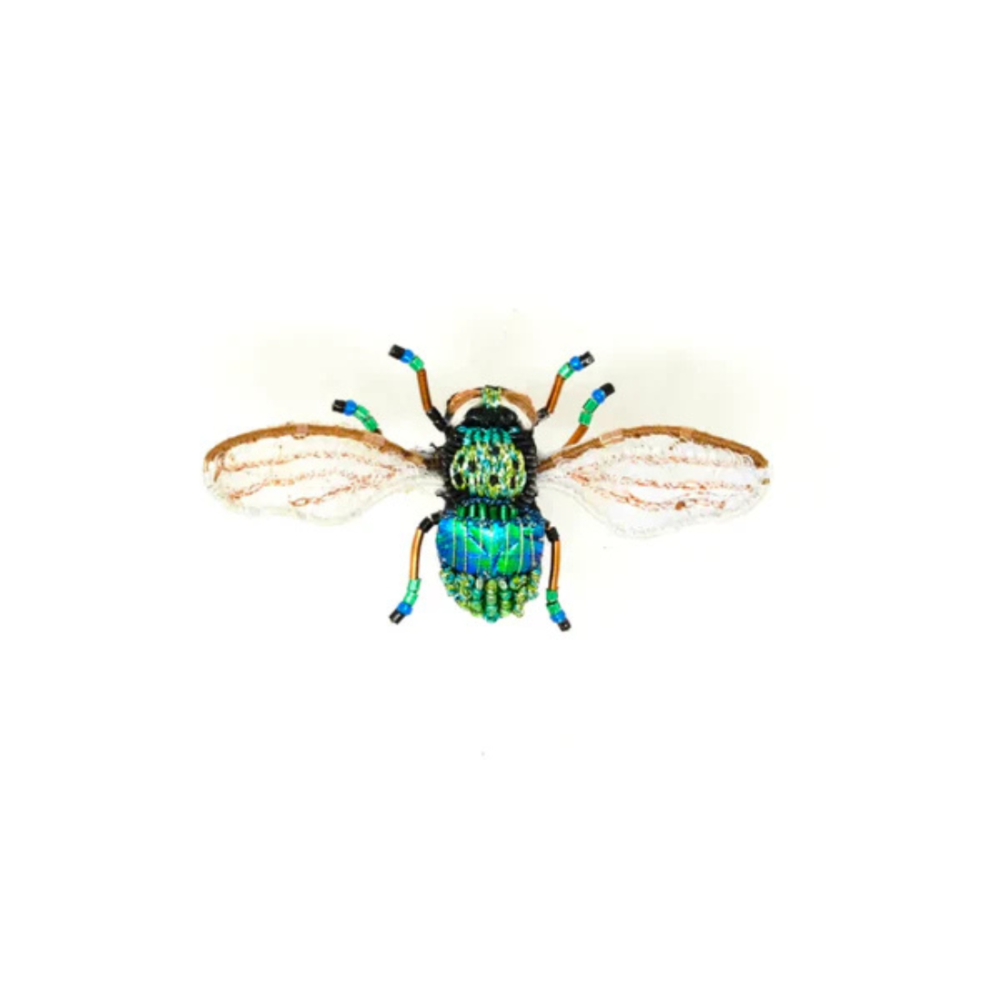 Hand embroidered and beaded bee broach. Be is iridescent blue and green with beads on it's body. It sort of resembles a beetle but it is not a beetle, it's a bee. It has gold wire legs with green and blue beads and gold beaded gossamer wings.
