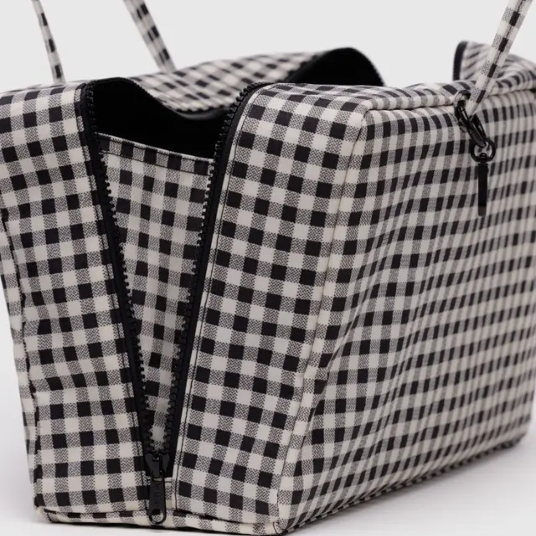 Detail of open bag shows a side gusset inside the zipper to maximize storage.