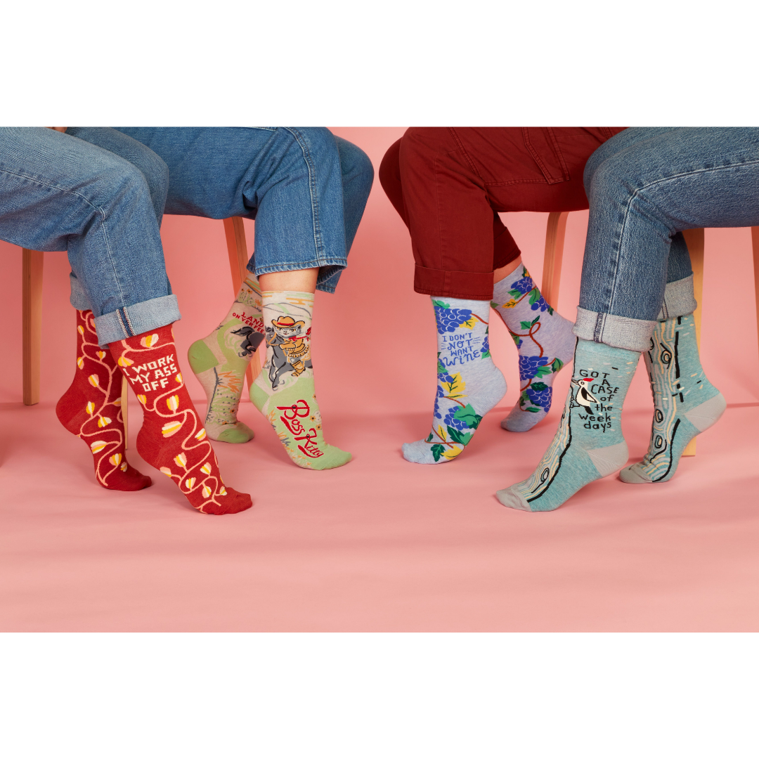 4 people wearing cute socks.
Sock party! Heck yeah!