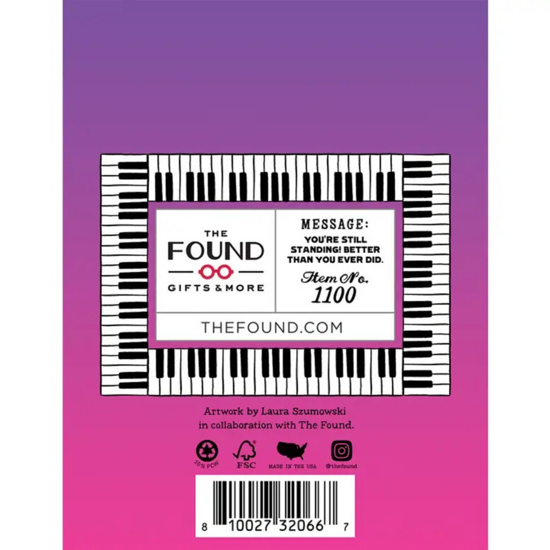 back of card is purple and pink with piano keys