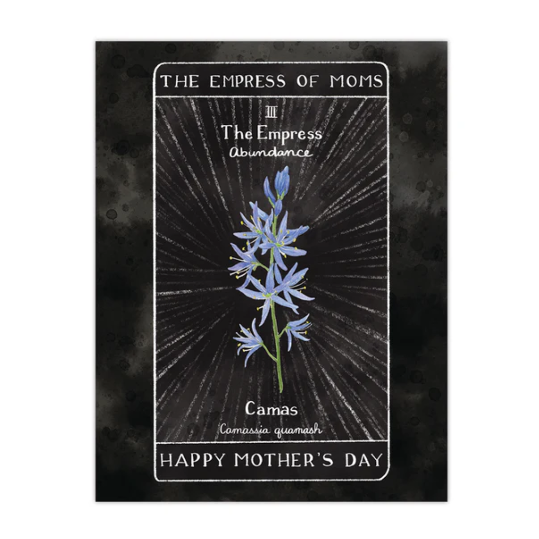 Card with a black background that resembles "The Empress" Tarot card. It reads "Abundance" with a watercolor painting of a Camas flower at the center. The card says, "The Empress of Moms" at the top and "Happy Mother's Day" at the bottom.