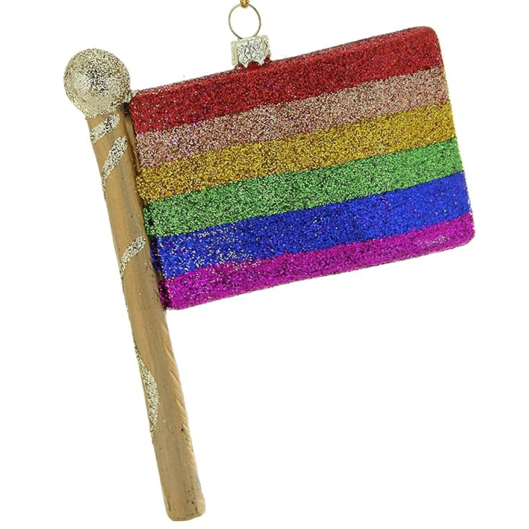 Glittery rainbow pride flag ornament on a stick with gold accents