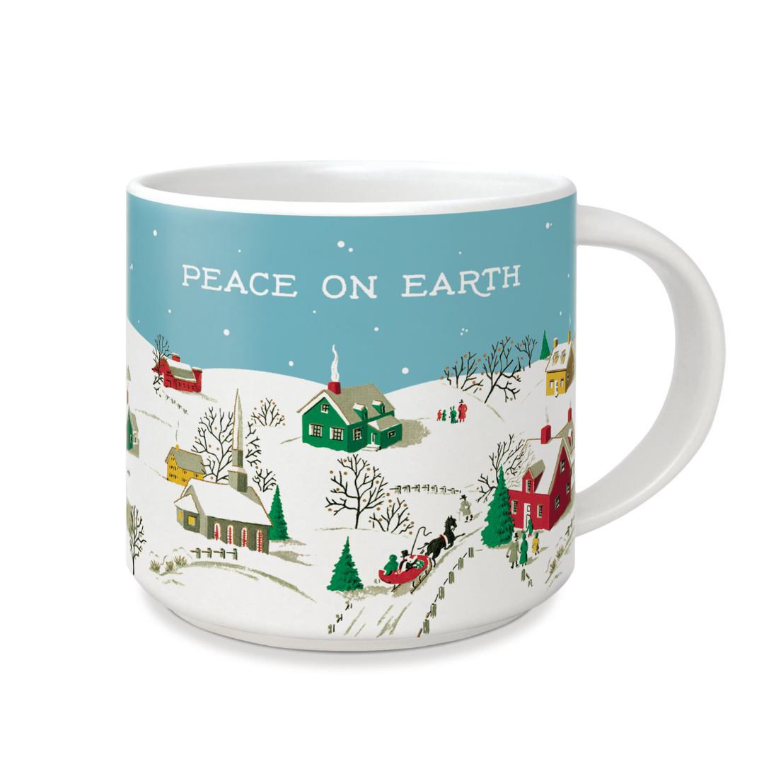mug with snow covered houses in green yellow and red with the words "peace on earth" in the blue sky