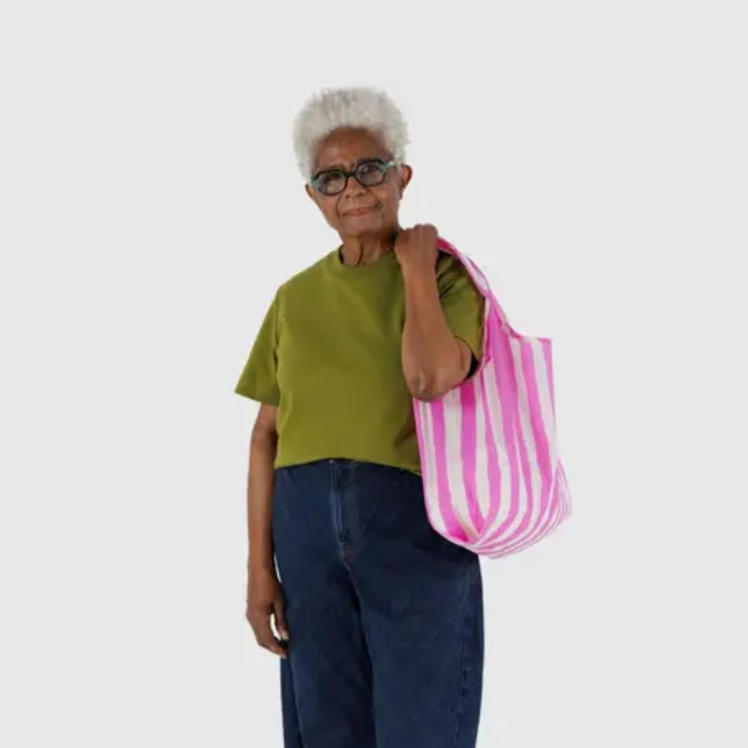 Model holding Baggu shopping bag