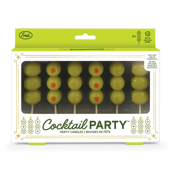 Packaging of cocktail party candles that look like green olives on toothpicks