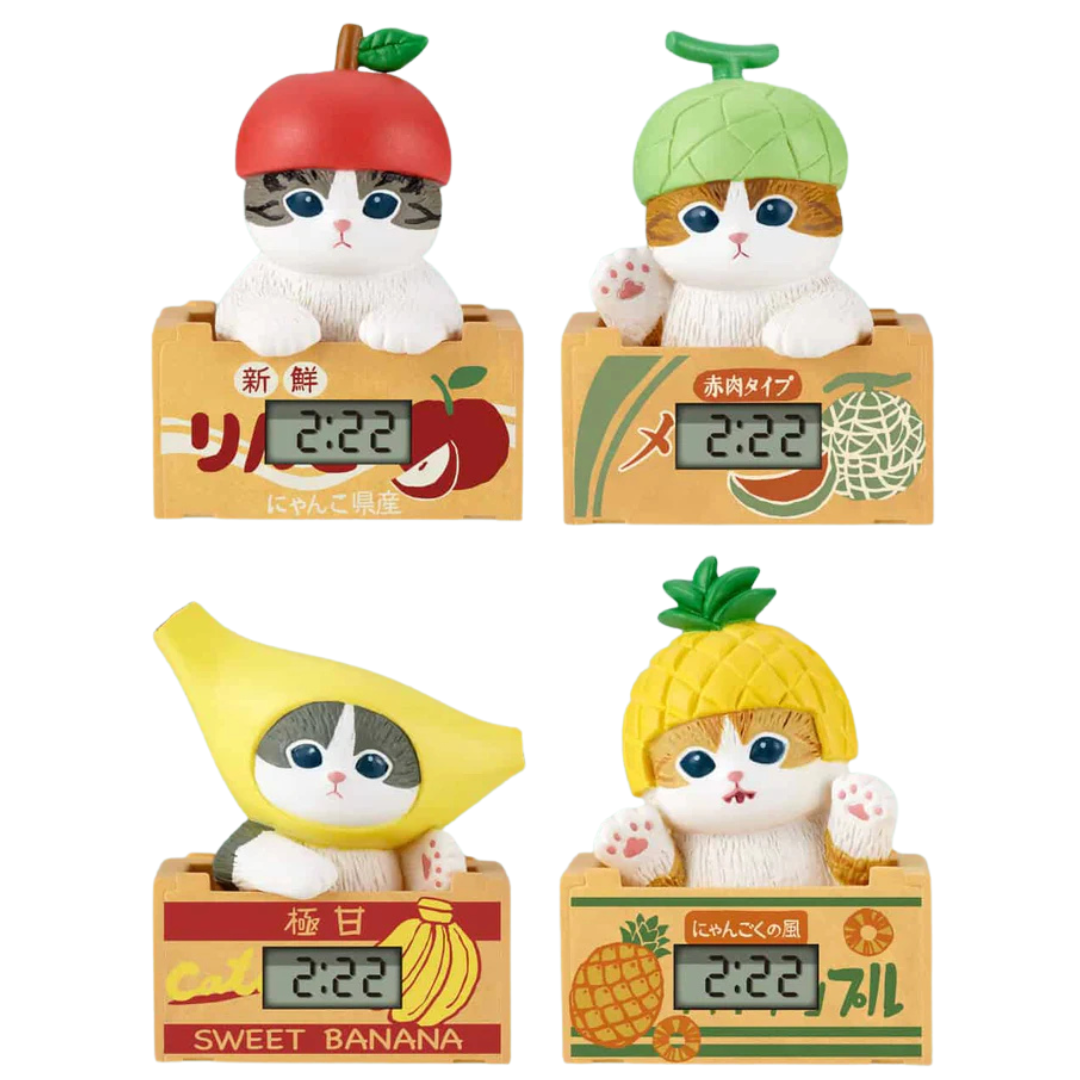 Four adorable cat-shaped digital clocks with fruit-themed designs: apple cat, melon cat, banana cat, and pineapple cat