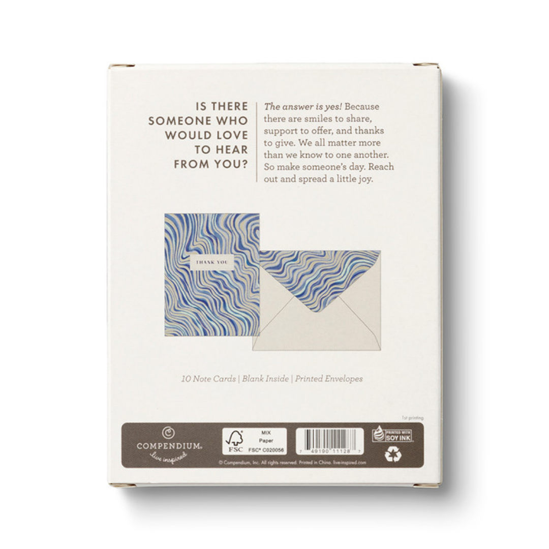 Back of the box of cards show an illustration of the card and envelope and says "Is there someone who would love to hear from you? The answer is yes! Because there are smiles to share, support to offer, and thanks to give. We all matter more than we know to one another. So make someone's day. Reach out and spread a little joy."