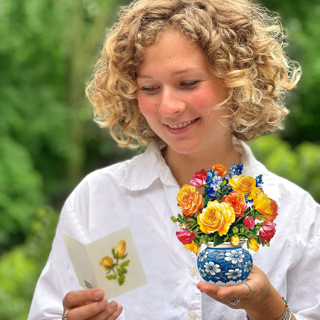 Woman holding the bouquet and the included note card
