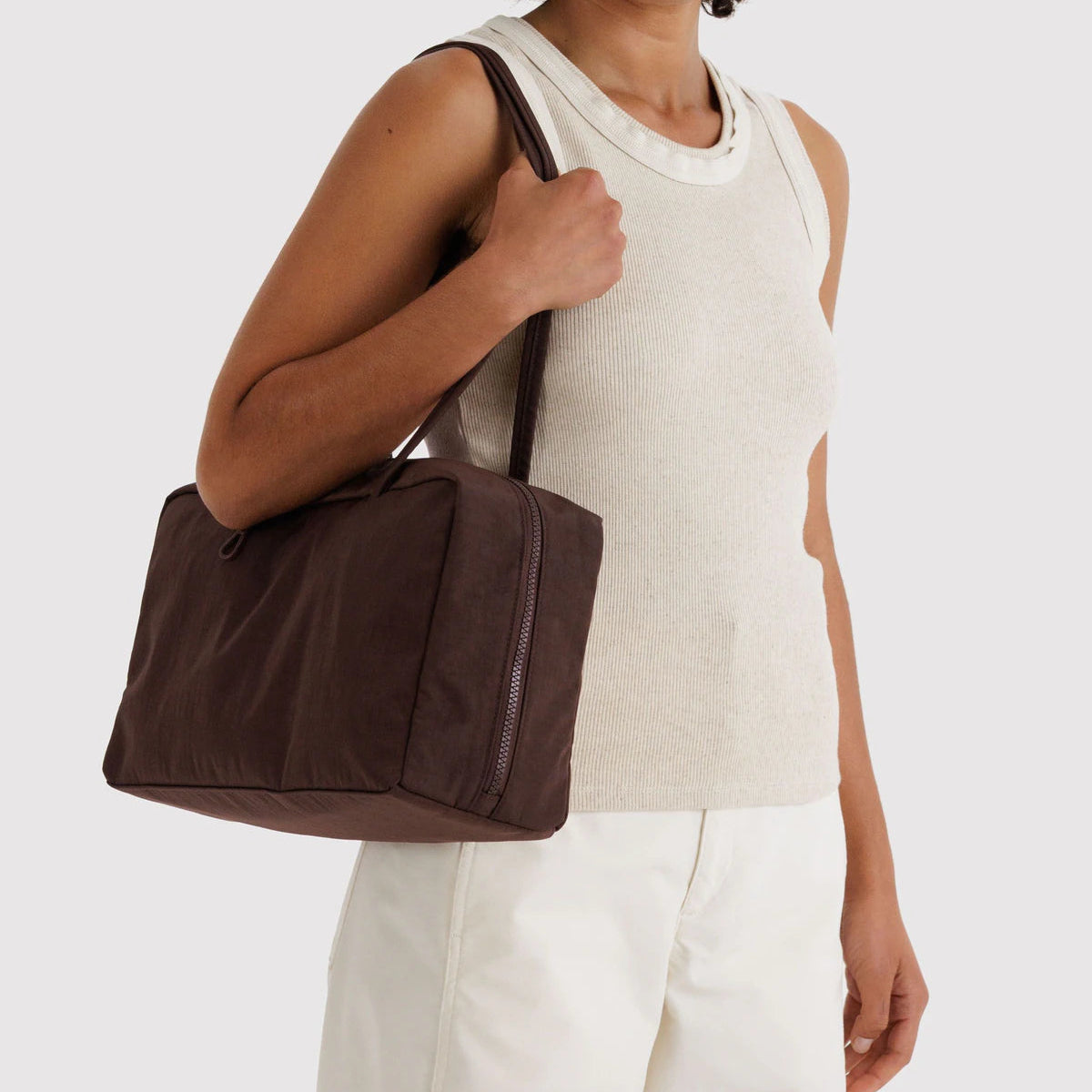 Coffee handbag with a strap on a light gray background