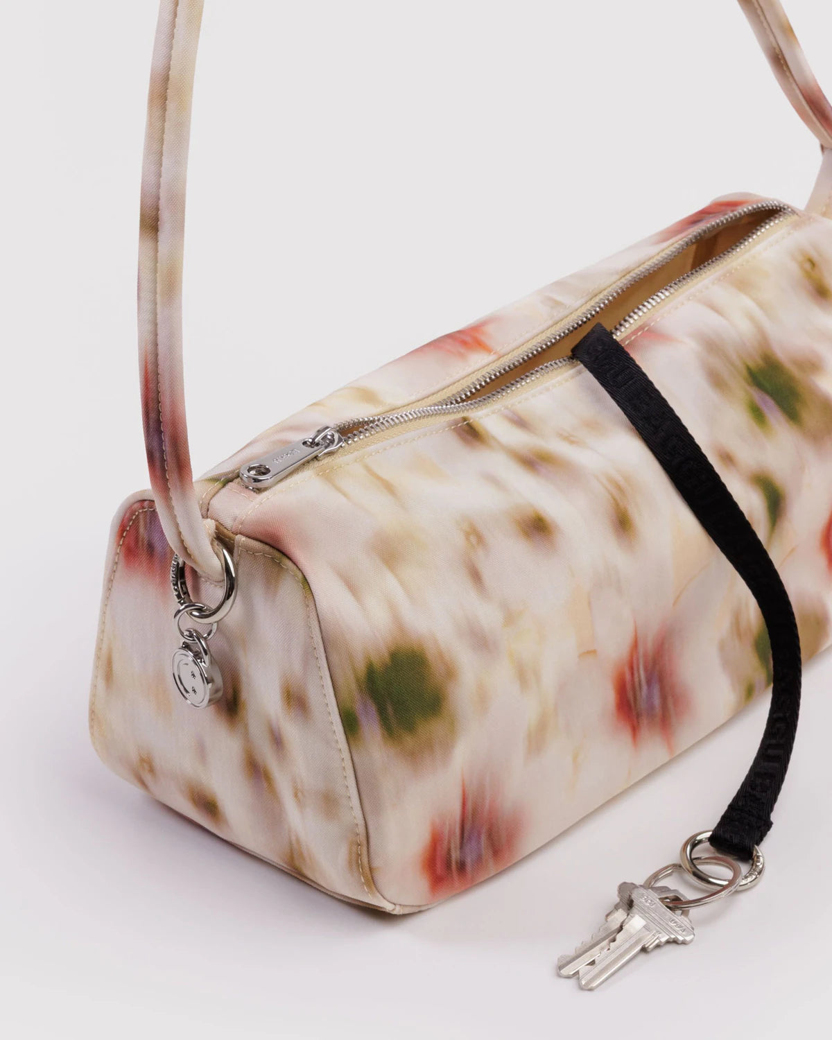 Colorful handbag with a floral pattern on a white background