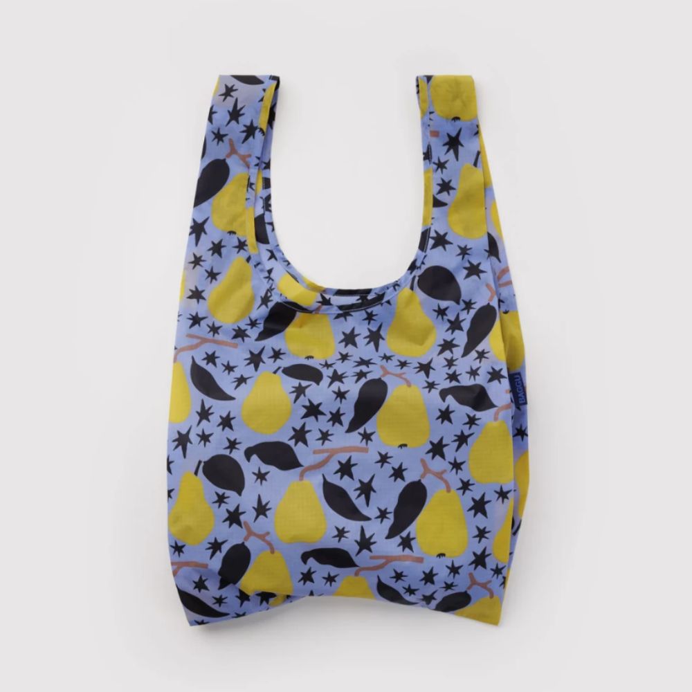 A reusable plastic bag with a blue background and a pattern of yellow pears and black stars, shown against a plain white background.