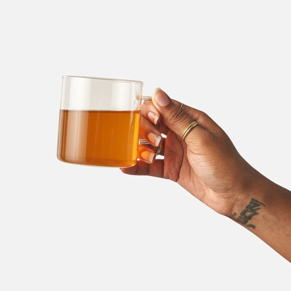Hand holding a cup of tea