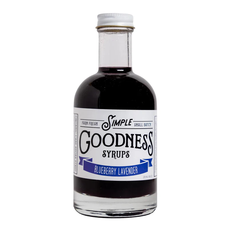 Bottle of Simple Goodness Sisters Blueberry Lavender Syrup is a deep purple color