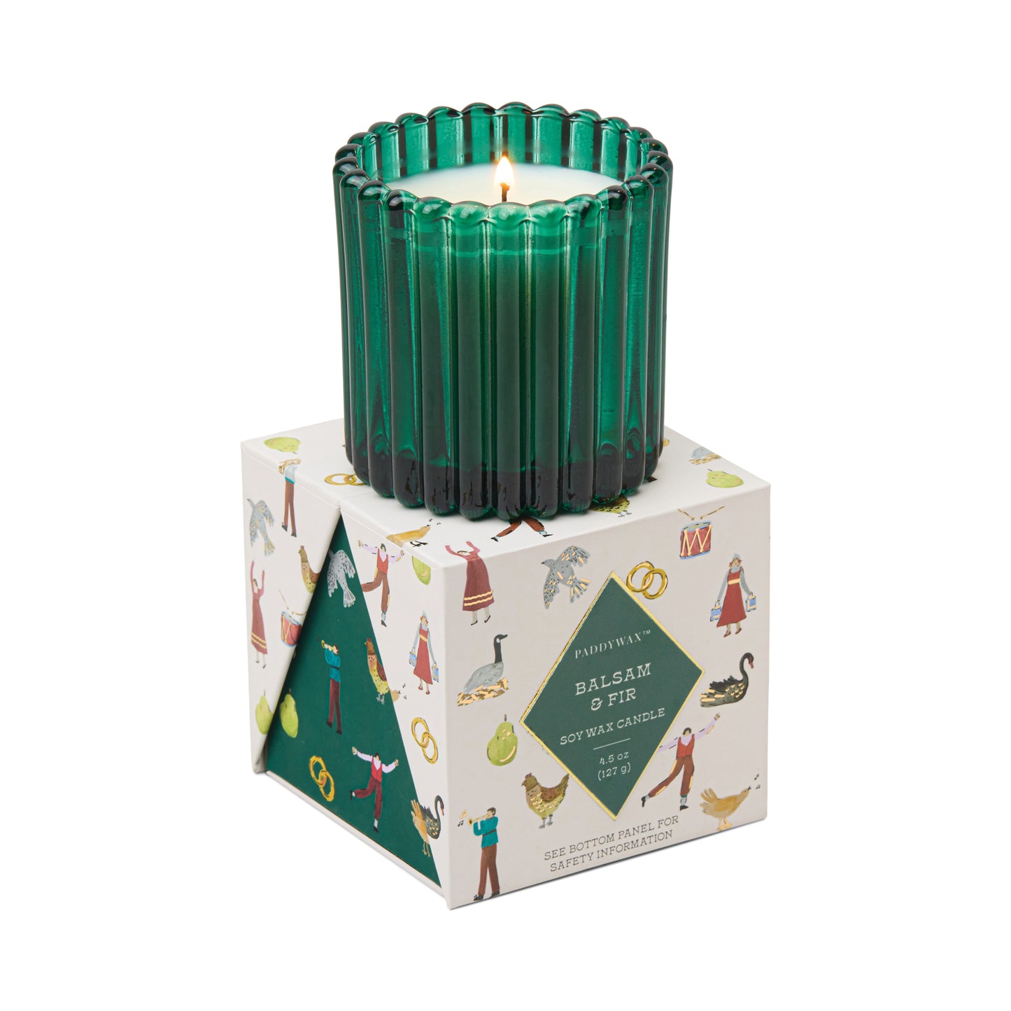 Candle in a fluted green glass container atop a presentation box decorated with the 12 days of Christmas. Label reads "Paddywax Balsam & Fir Soy Wa Candle"