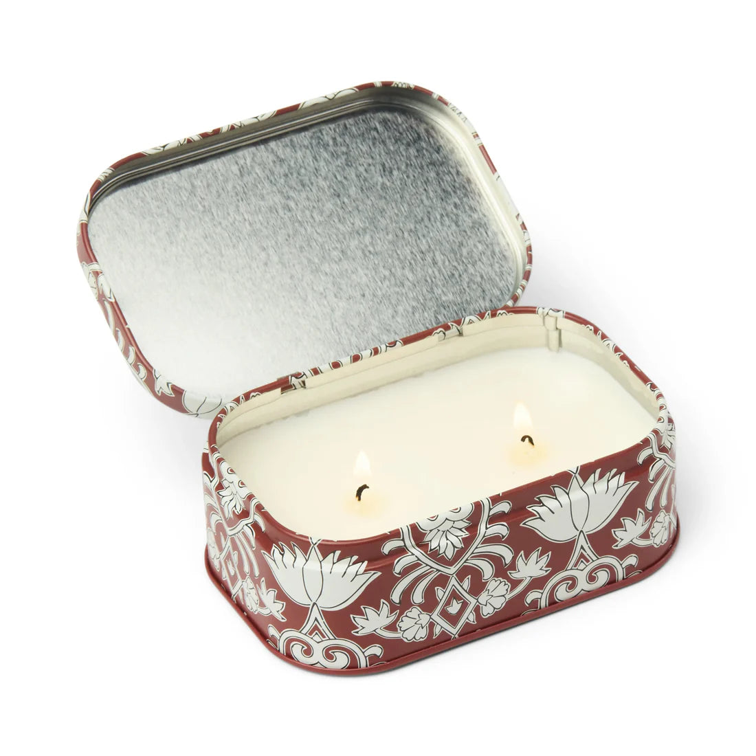 Decorative candle in a tin with floral patterns