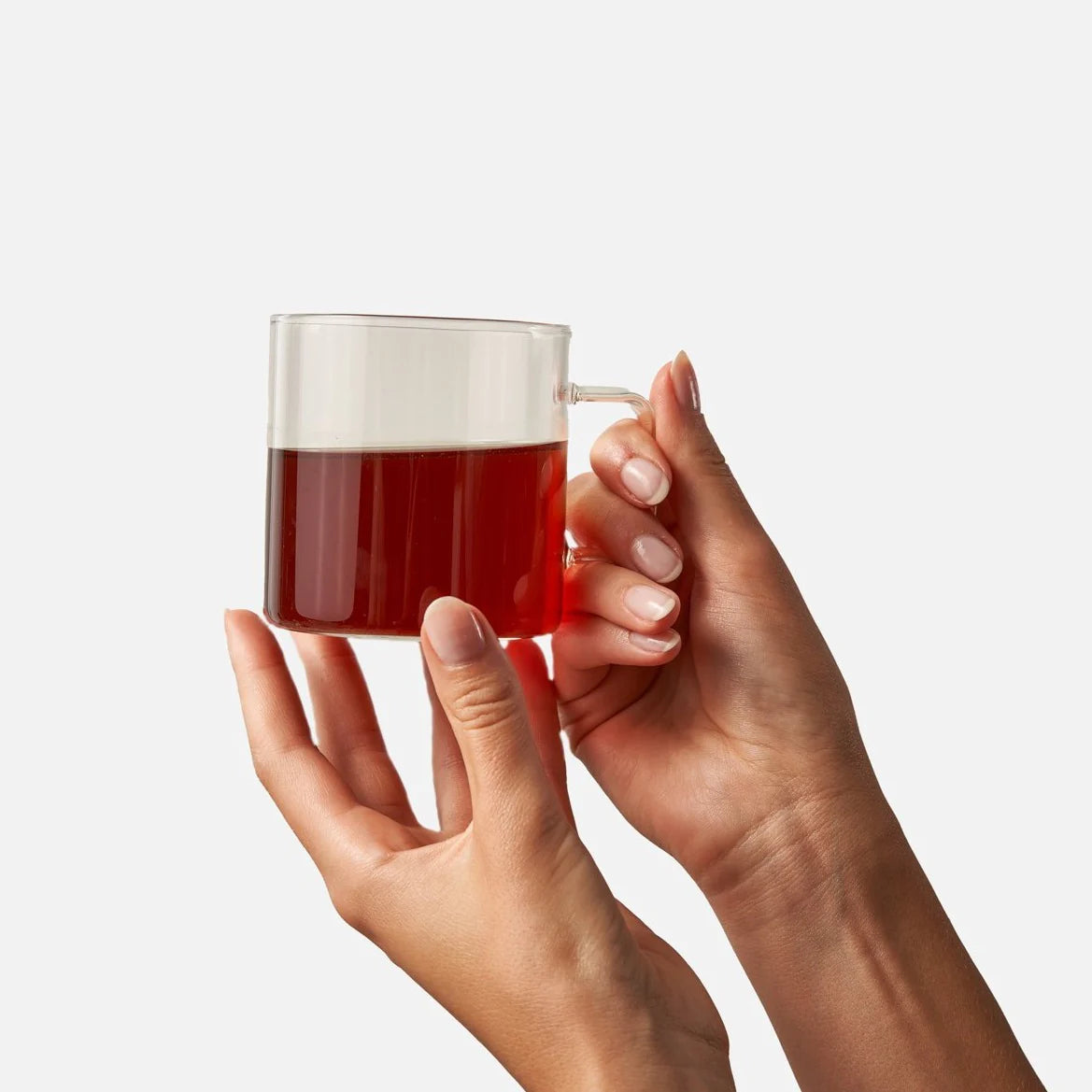 Hands holding a cup of tea