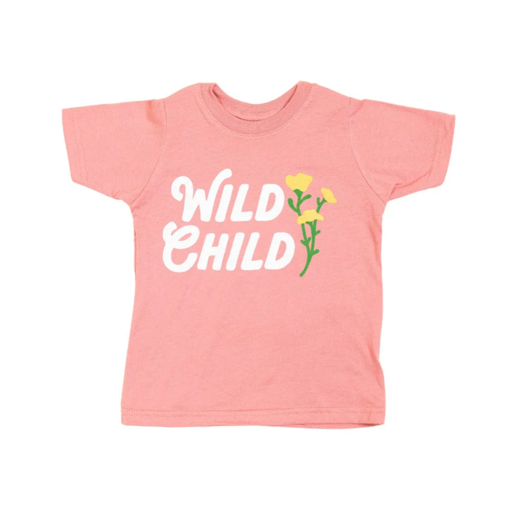 Pink t-shirt that reads "Wild Child" in white with golden wild flowers