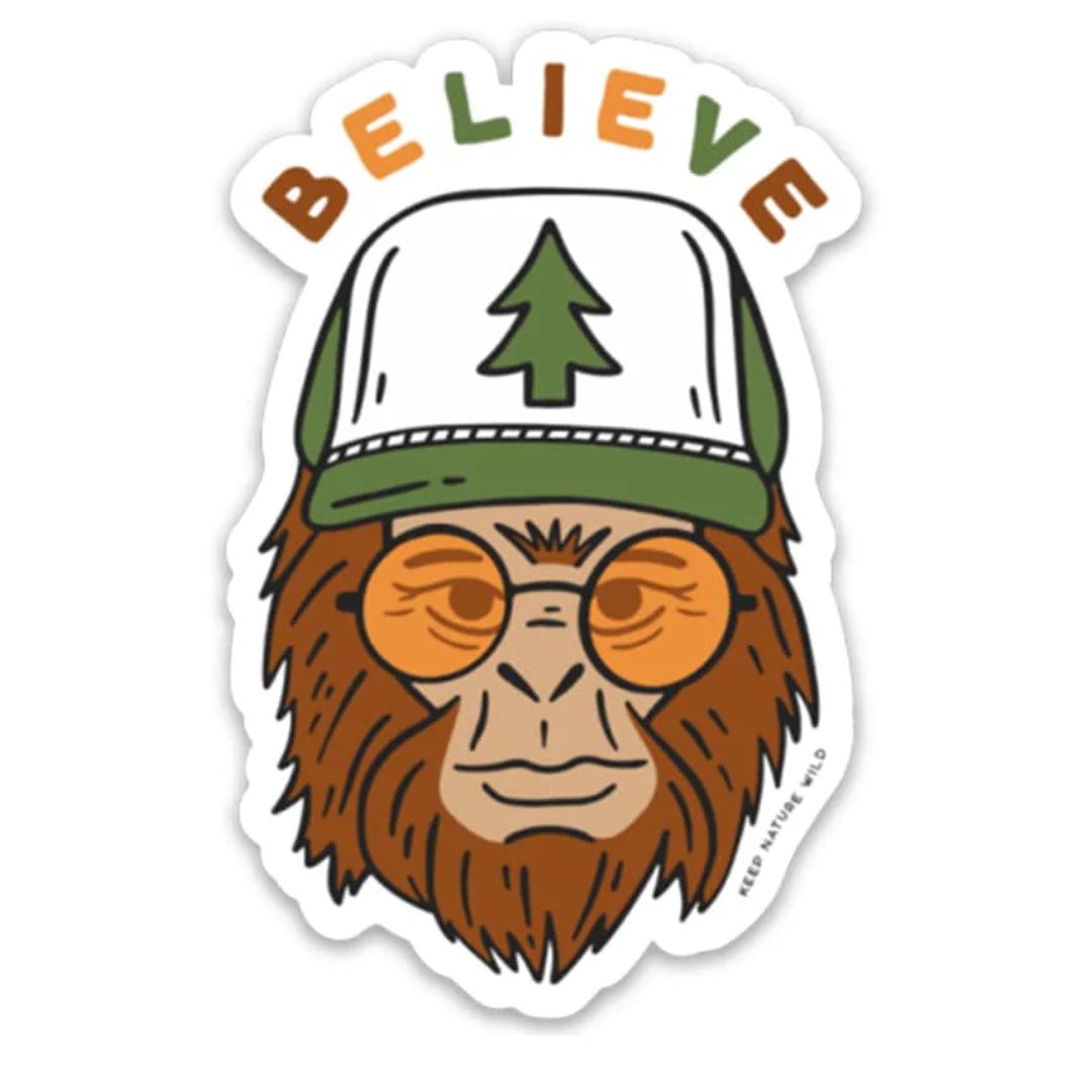 Sasquatch in a trucker cap and sunglasses with "Believe" above his head