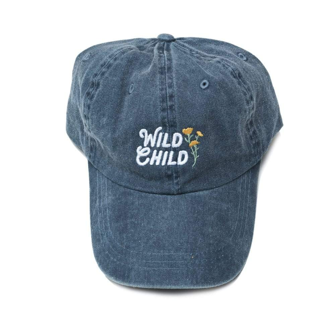 Distressed navy ball cap with "Wild Child" and some golden wild flowers embroidered on it.