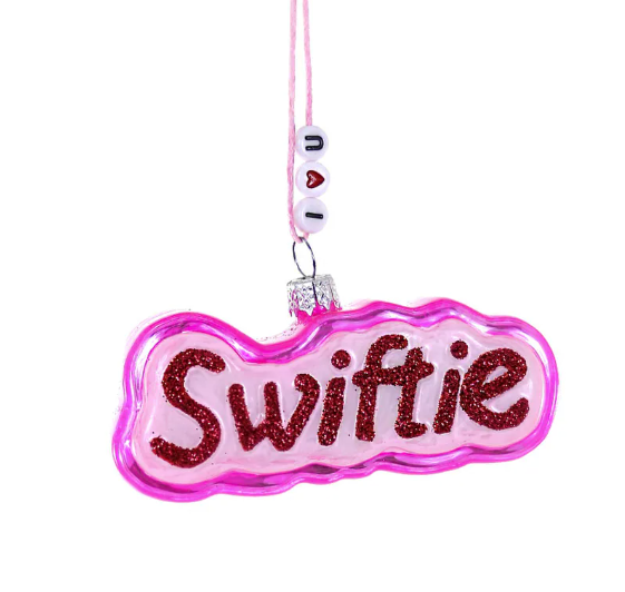 Pink and red 'Swiftie' glass Christmas ornament. Hanging cord has friendship bracelet beads that say "I heart U"
