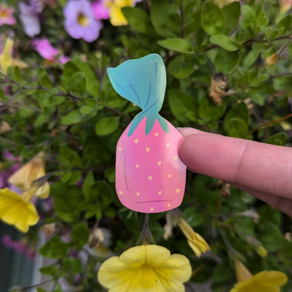 Holographic sticker in a strawberry candy shape.