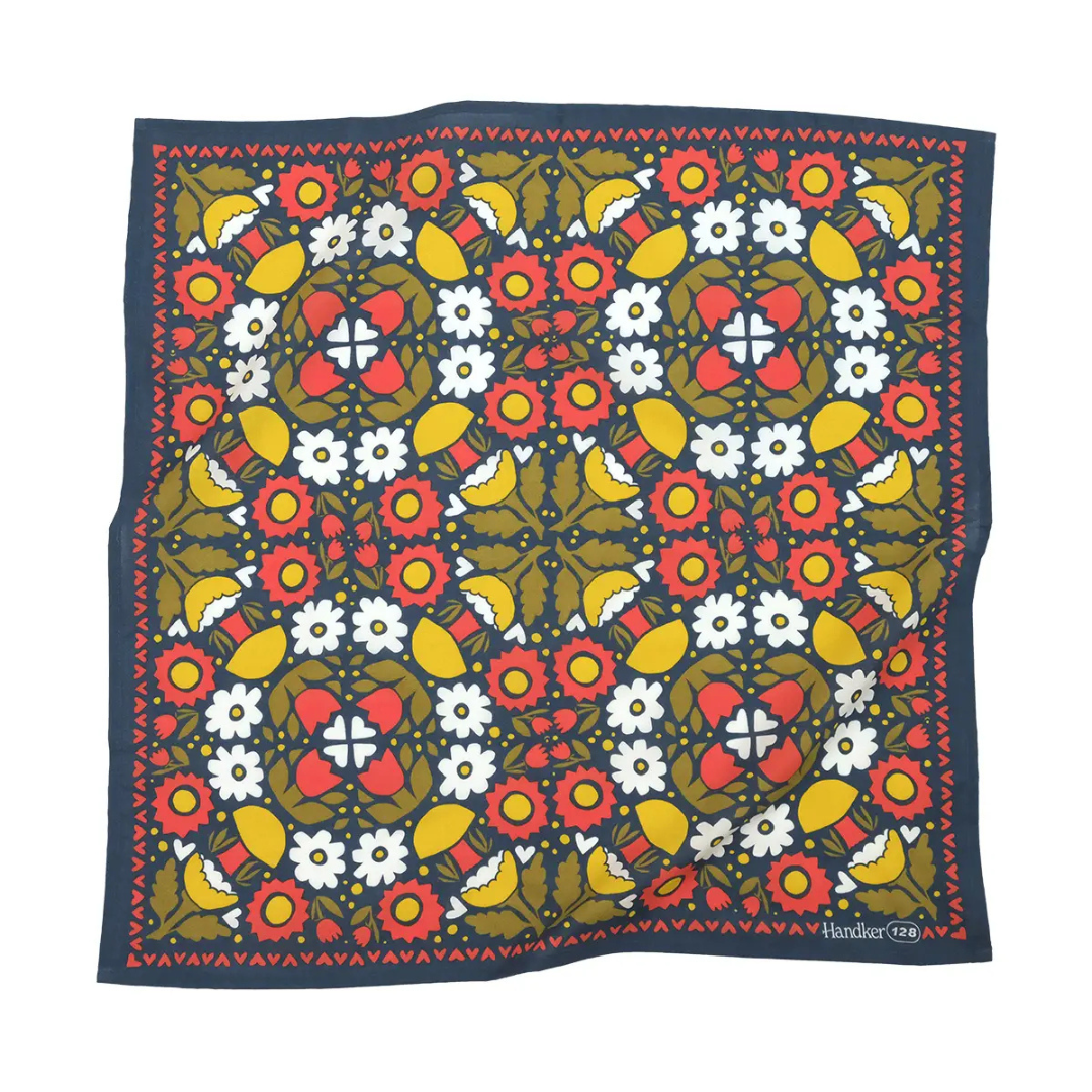 Colorful kaleidoscope designed bandana in coral, gold and olive hues.