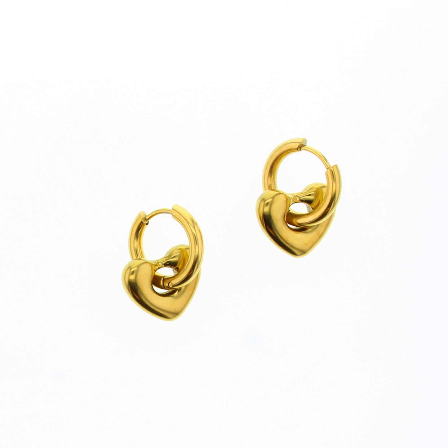 Small gold hoop earrings with heart shaped beads dangling from the hoops