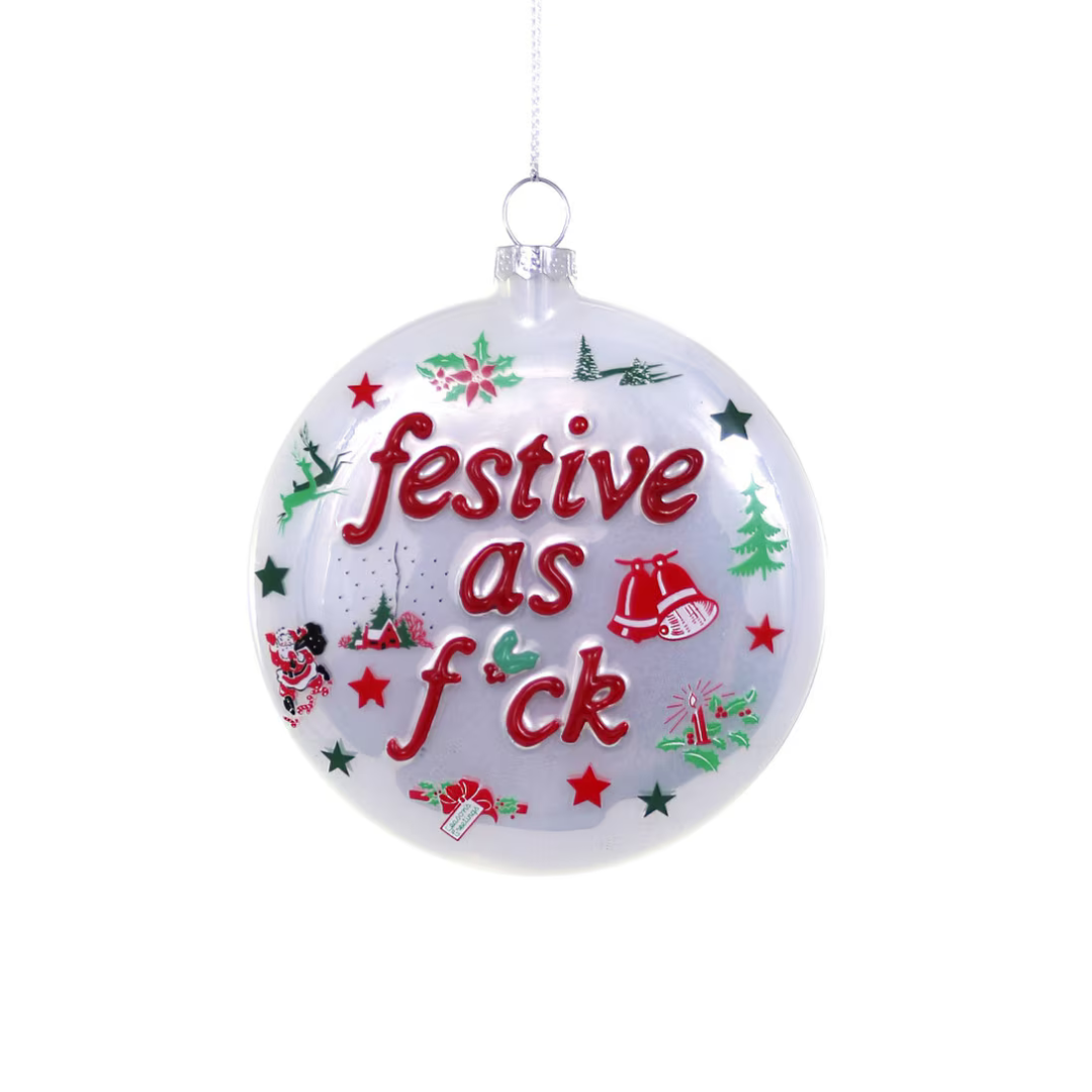 White ornament is decorated with various Christmas decals and says "Festive as f*ck"