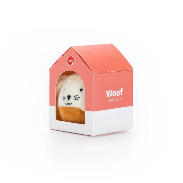 Pup in their box. The box looks like a doghouse