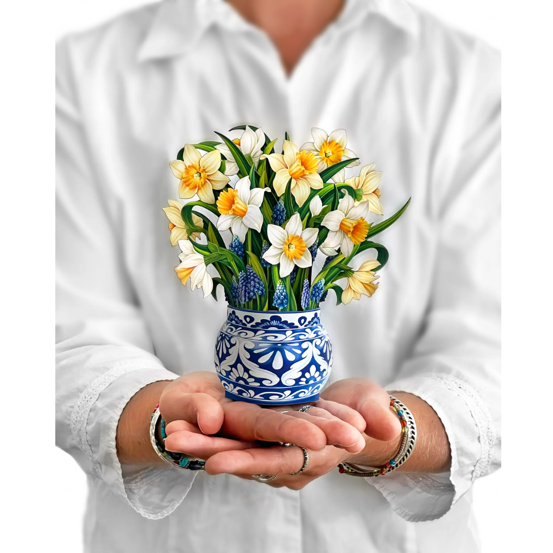 Person holding the Daffodil bouquet for scale