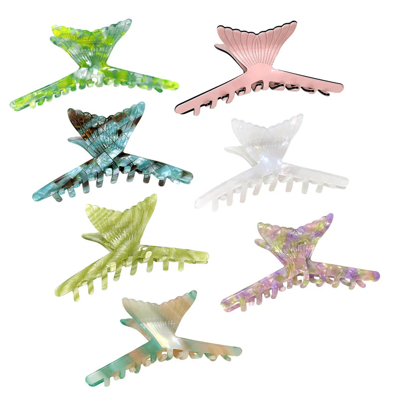 Selection of mermaid tail shaped claw hair clips in a variety of oceanic colors.