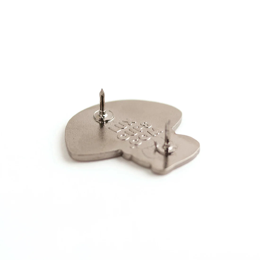 Back features two pins and the LuxCups logo