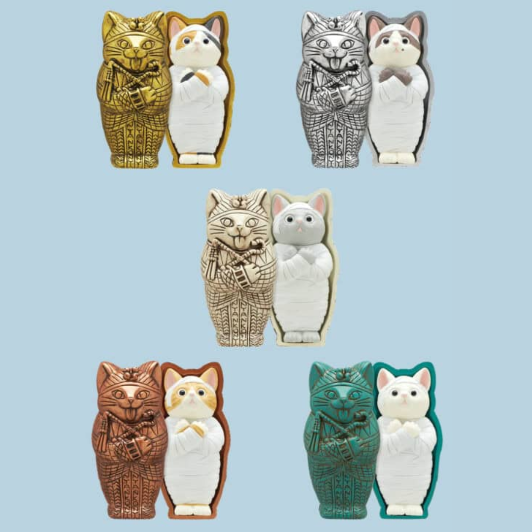 Five different mummy cat figurines against a blue background.
