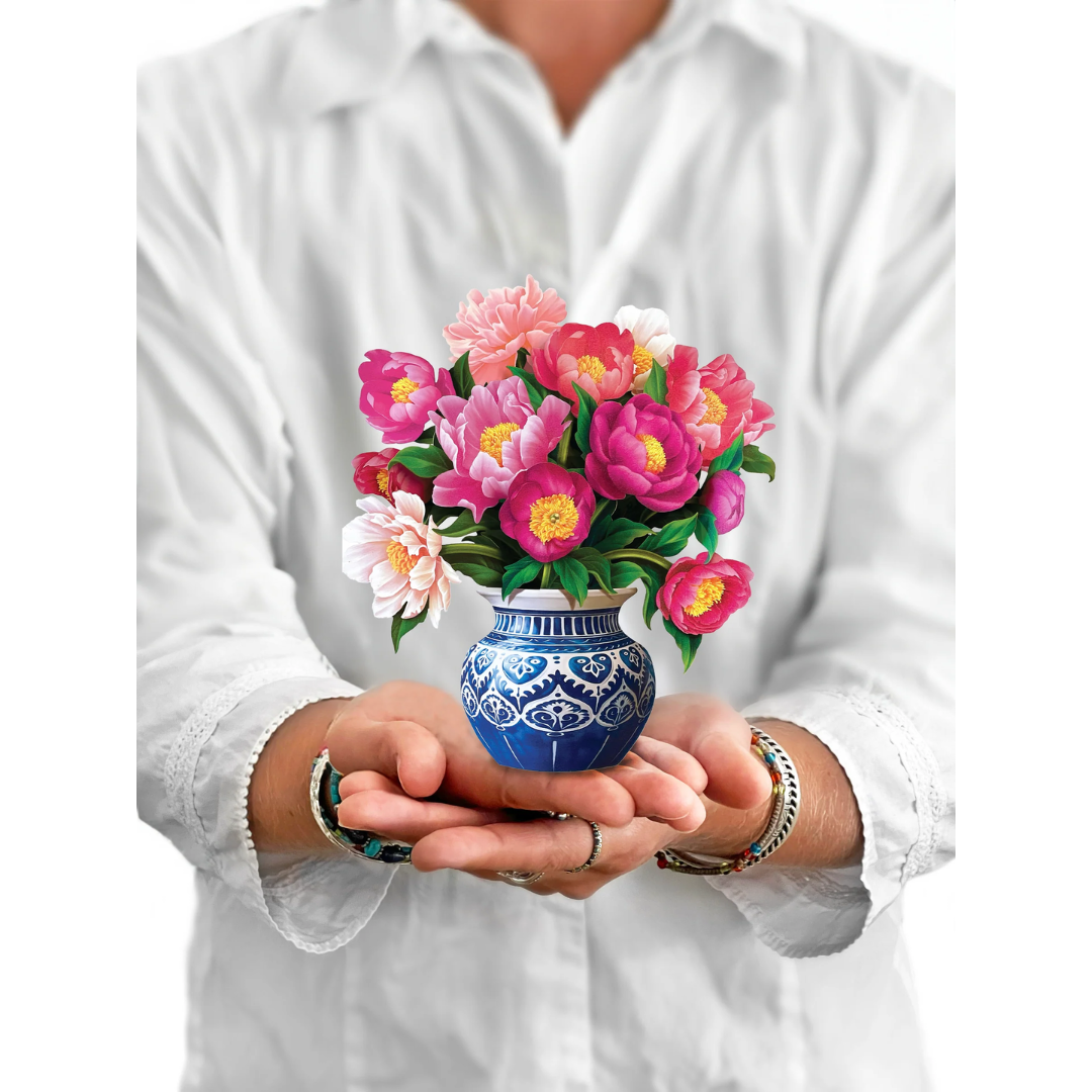 Person holding Mini bouquet for scale