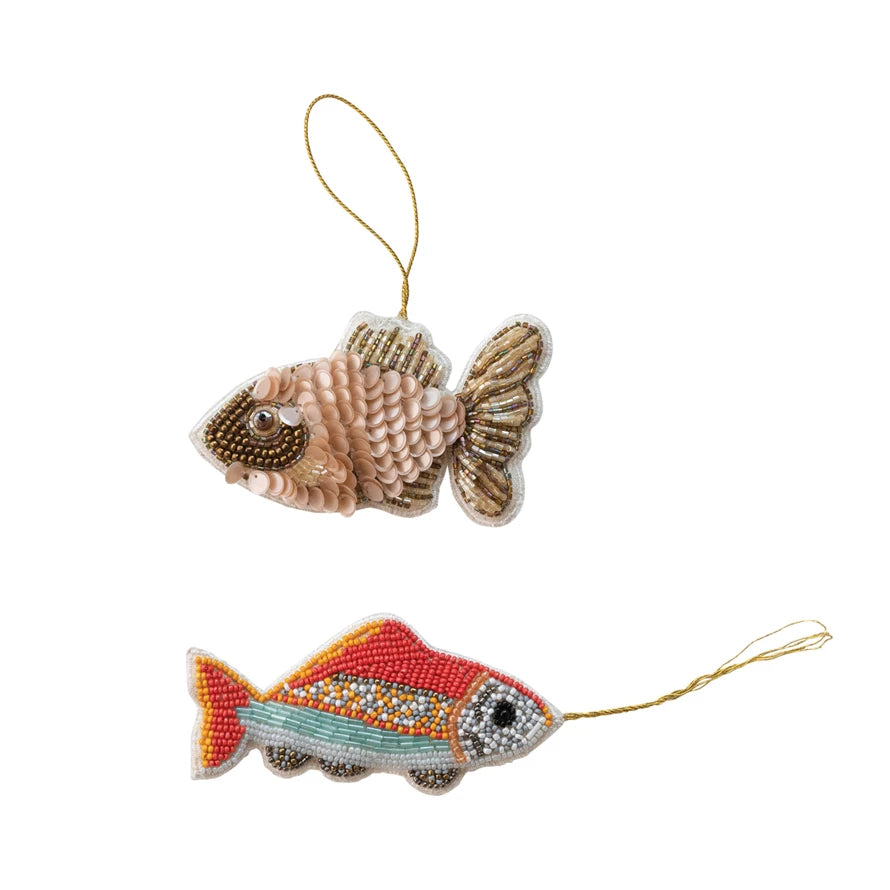 Two beaded fish ornaments - top one is shades of gold and beige with sequin scales, bottom one is beaded with bright coral, yellow, and aqua beads with silver and white beaded accents.
Sold individually and not as a set