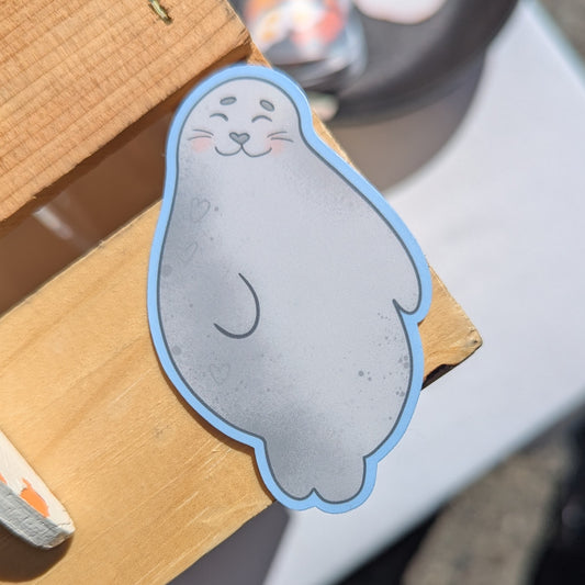 Sticker of a fat happy seal with a heartshaped nose