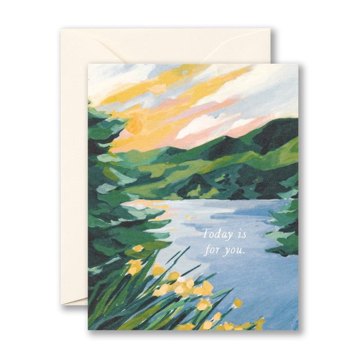 Card featuring a pretty landscape of a lake with trees, yellow flowers, and mountains 
Card reads: Today is for you.