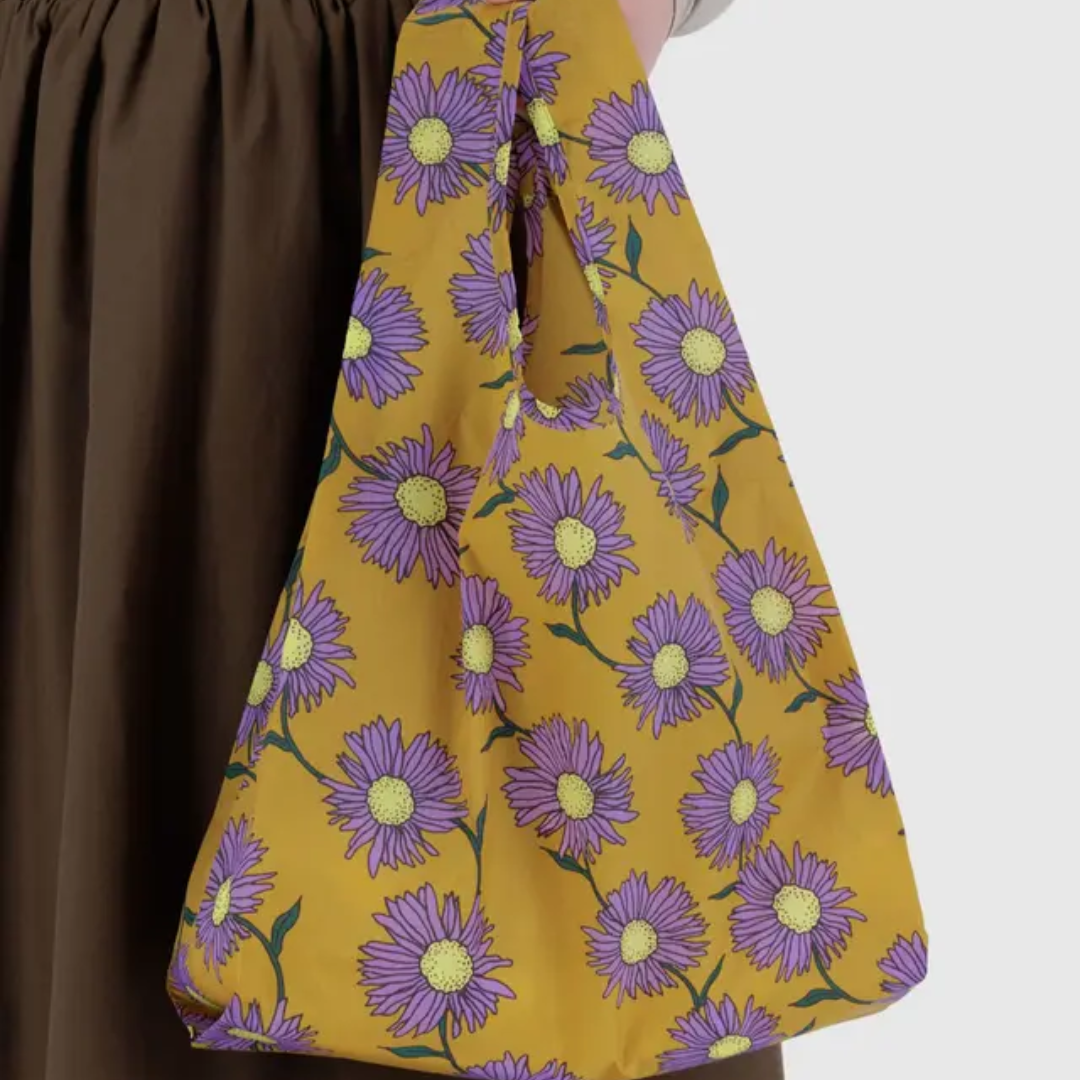 Model holding shopping bag