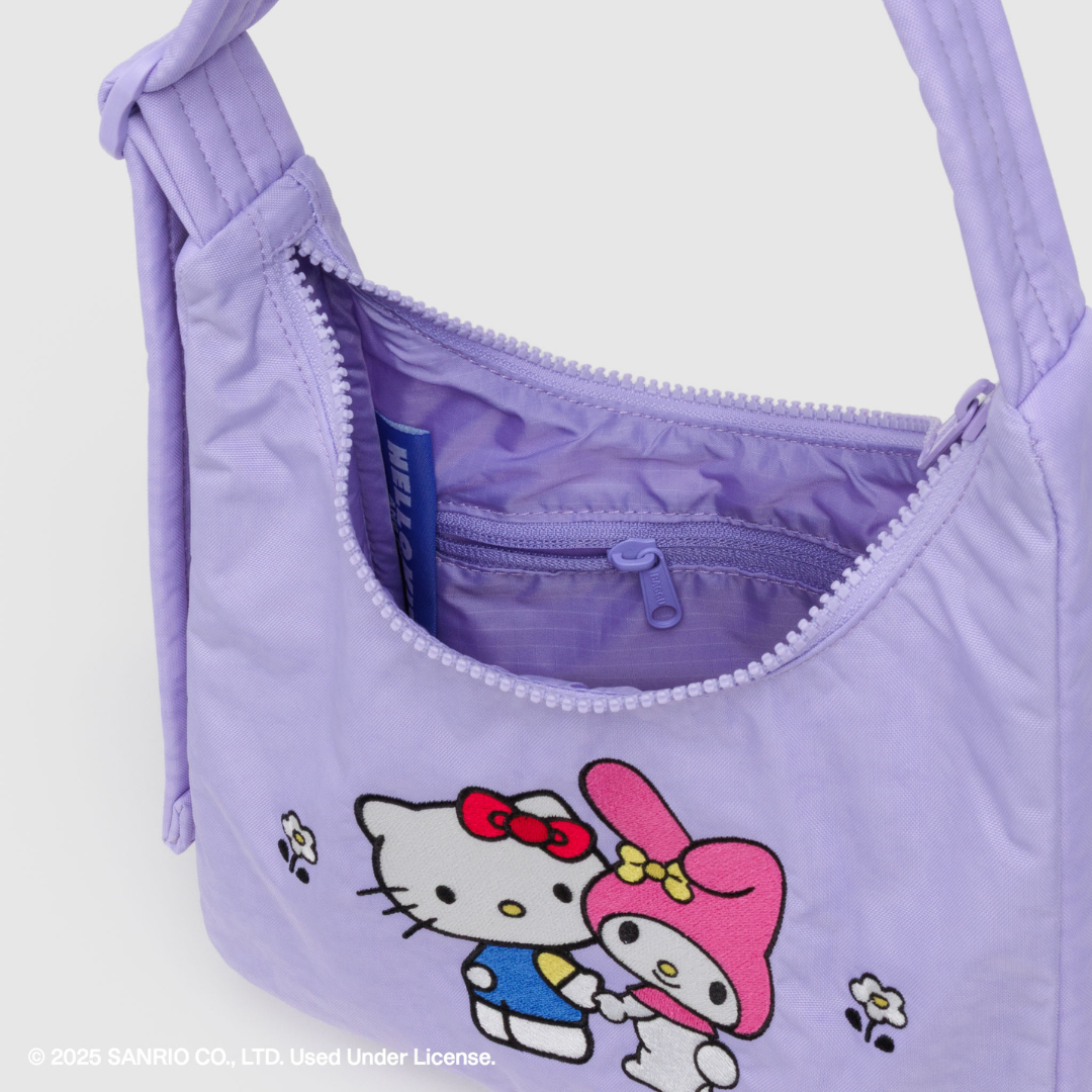 Bag open showing detail of the inside and the embroidery on the front