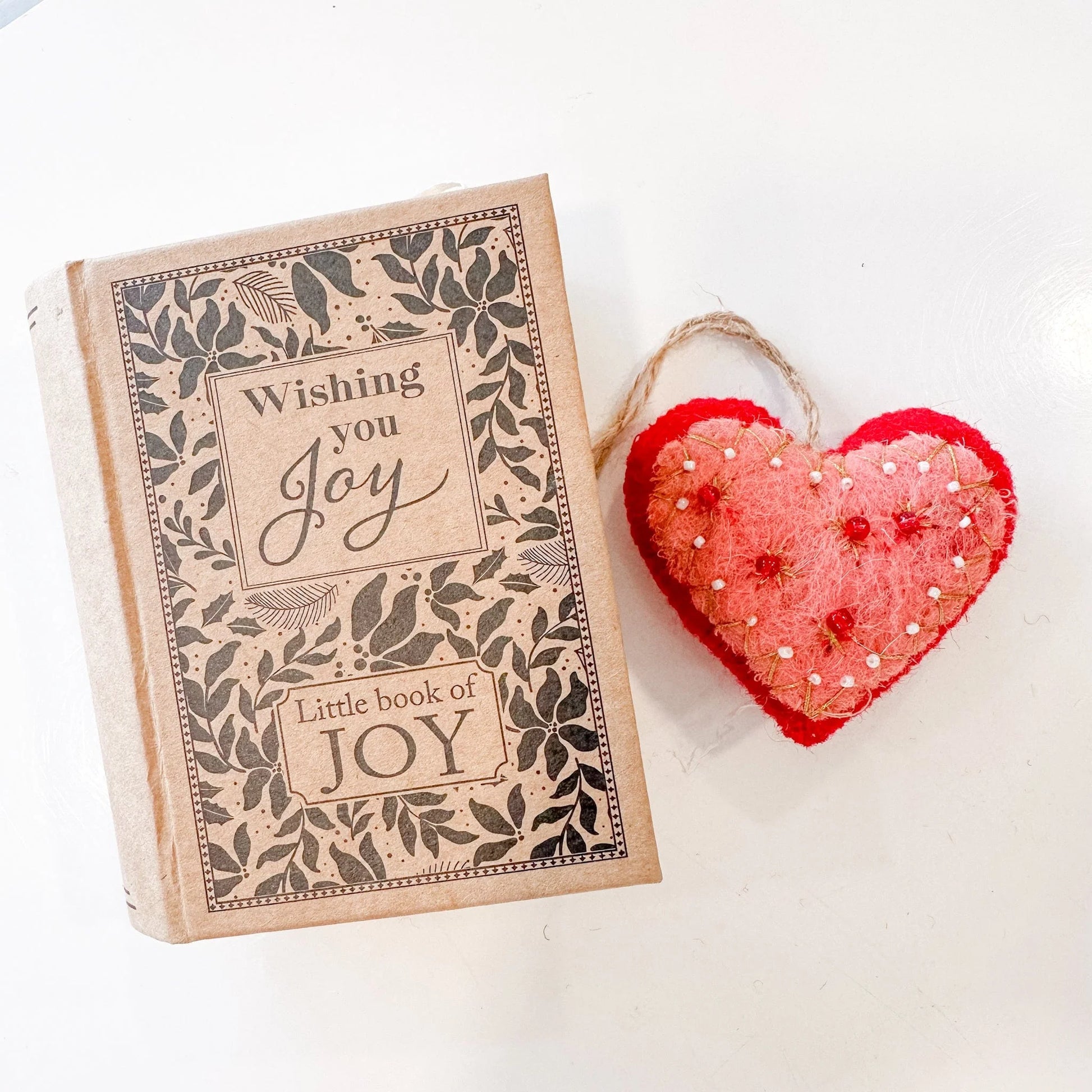 Red & pink heart ornament decorated with red and white beads with a book shaped box that says "Wishing you Joy/Little book of Joy"