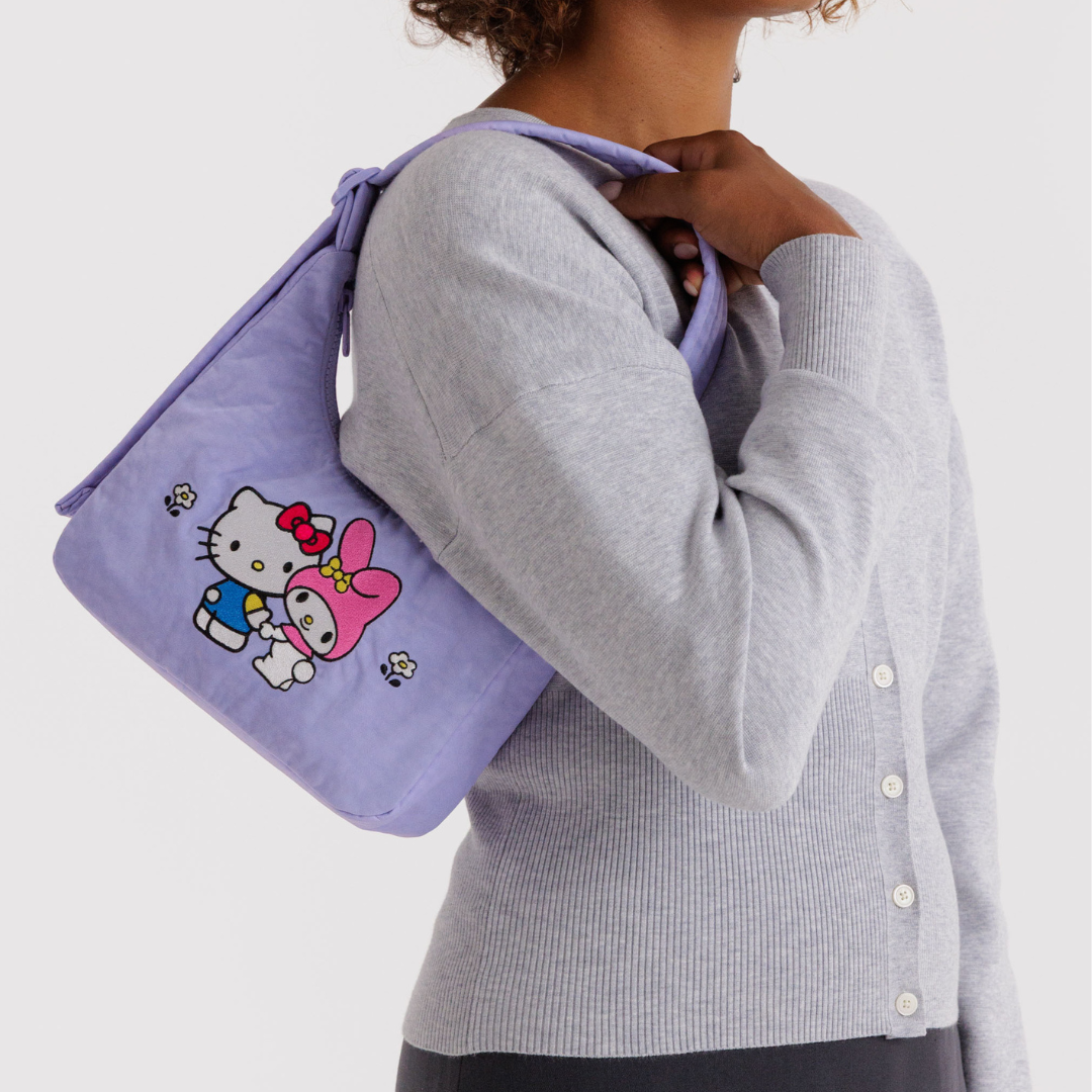 Model wears the bag on their shoulder