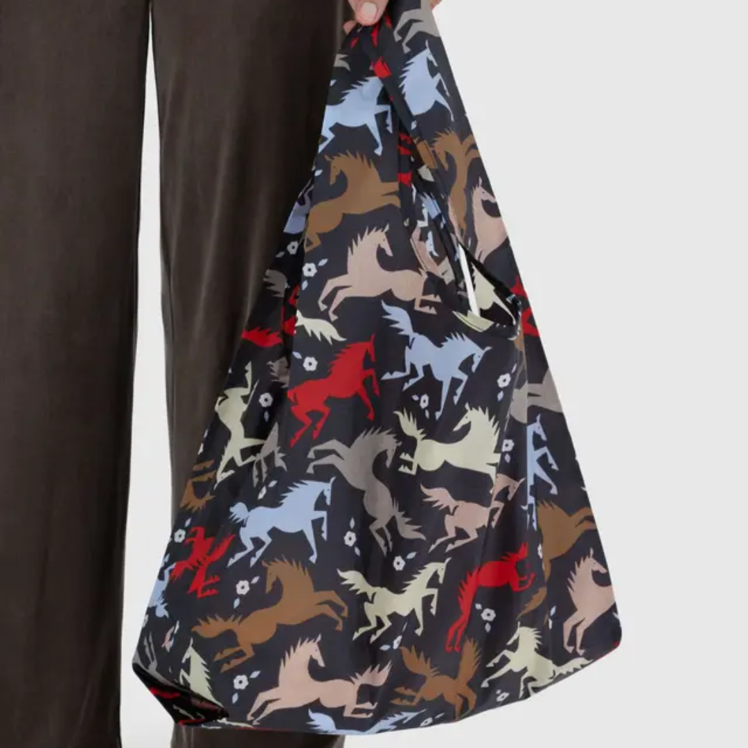 Model holding shopping bag