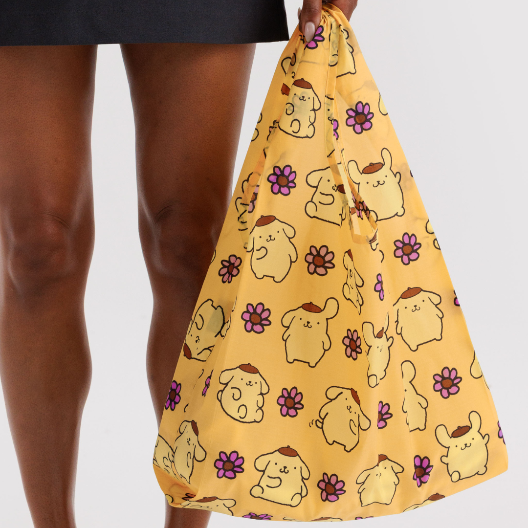 Model holding the standard baggu bag