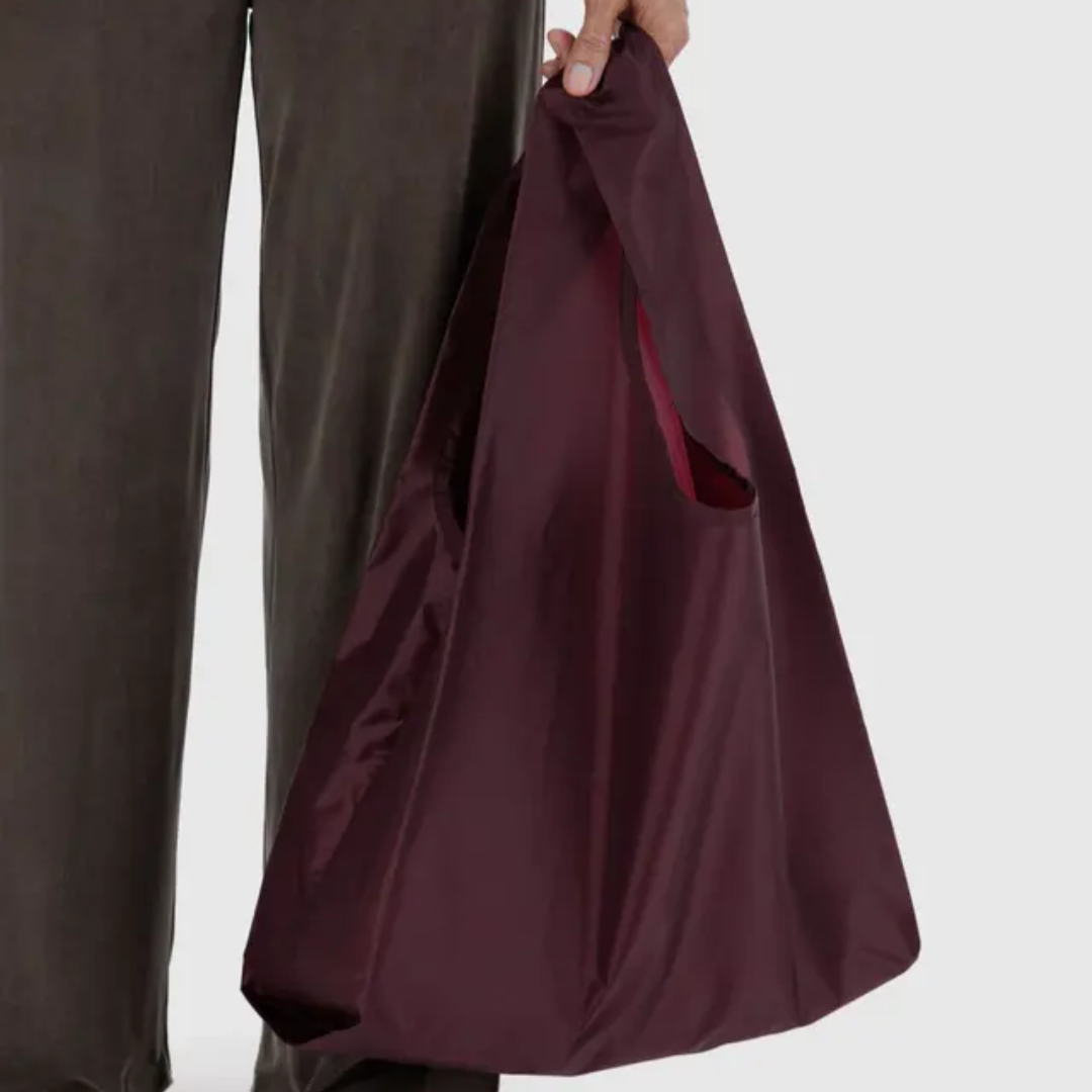 Model holding shopping bag
