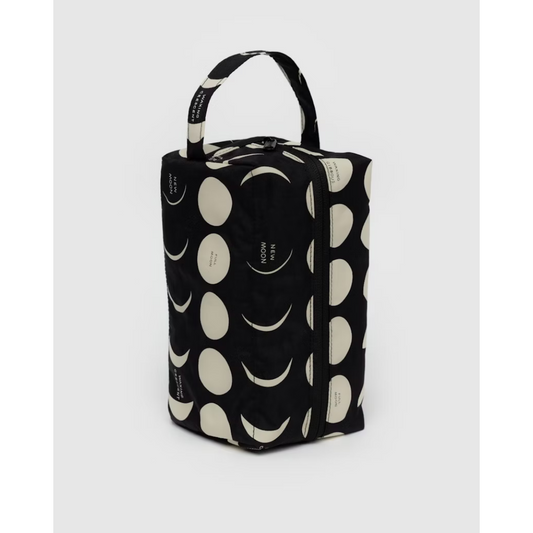 Toiletry travel pouch in black featuring a moon pattern all over.