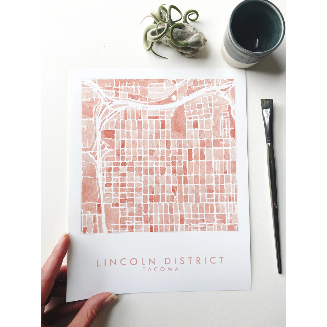 Tacoma neighborhood map featuring the Lincoln District in a salmon color and the words "LINCOLN DISRICT TACOMA" underneath.