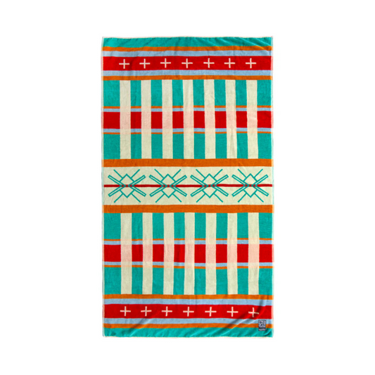 Tribal patterned beach towel featuring striping and cross pattern in hues of red, orange, yellow, green and blue.