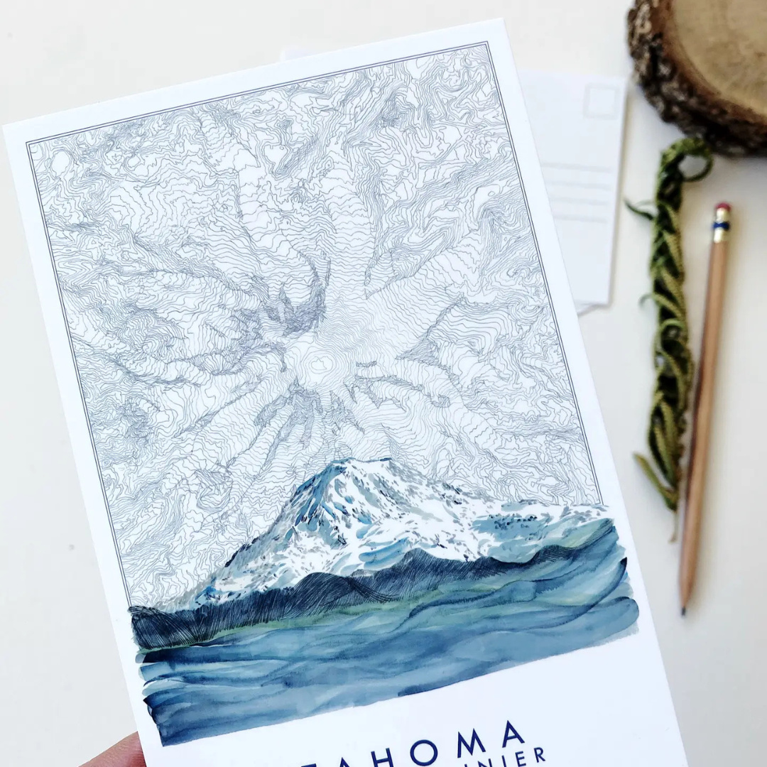 Postcard featuring Mount Rainier blended with a topographical view of Mount Rainier in several hues of blue. The words "TAHOMA MOUNT RAINIER" sit underneath it.