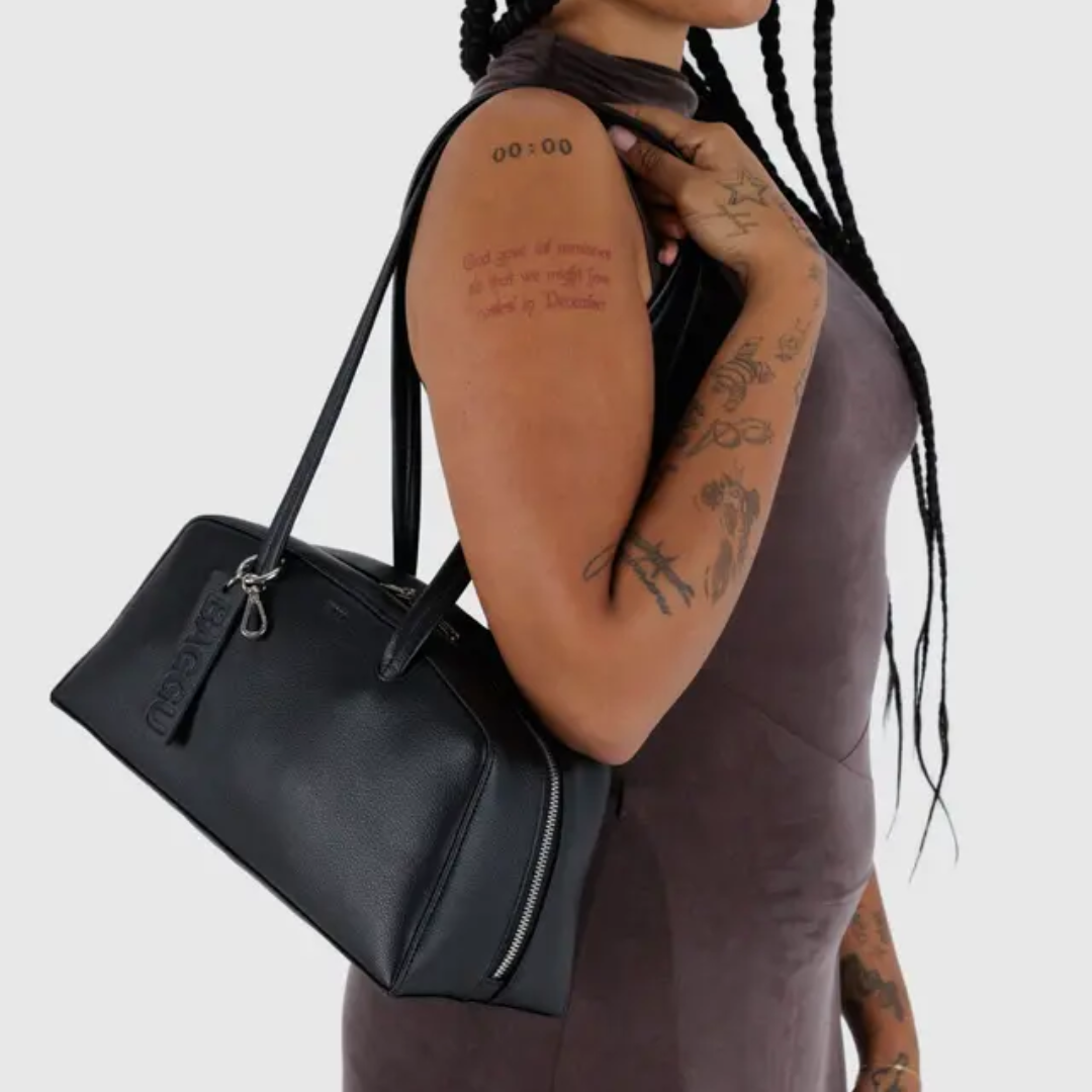 Model wearing the bower bag. Bag falls at the hip